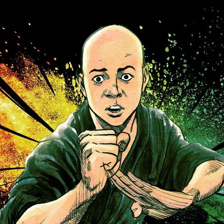 Fa Sheng is wearing a green martial arts clothes as he is posing to fight.